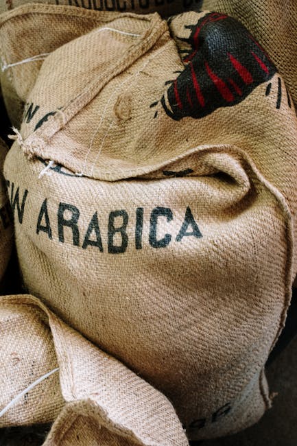 Fair Trade Coffee USA Explained Clearly and Deliciously 4 Detailed image of a burlap sack labeled with Arabica coffee beans.