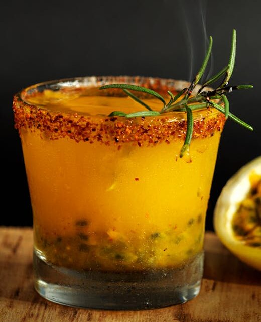 Vibrant mezcal cocktail enhanced with passion fruit and herbs in Guanajuato, Mexico.